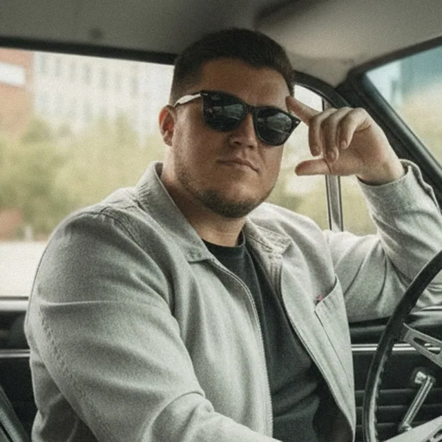 Portrait of Nick Iakzhin in a car